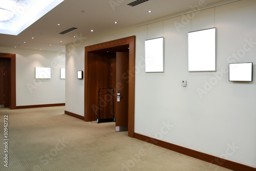Photo: modern hall with white placards modern hall with white placards