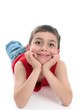 Photo: Cute smiling boy relaxing looking ahead Cute smiling boy relaxing looking ahead