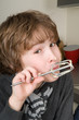 Boy Eating Dough From A Beater