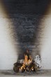 Flames burn from firewood and sunlight