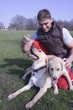 A man and his two dogs in the park