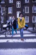 Two female adults walking across the zebra crossing
