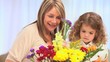 Video: A girl and her grand mother making a bunch of flowers A girl and her grand mother making a bunch of flowers