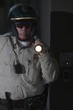 Nightwatch patrolman with flashlight