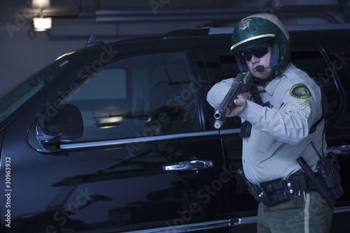 Photo: Nightwatch patrolman aiming rifle Nightwatch patrolman aiming rifle