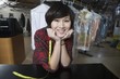 Happy woman working in the laundrette