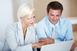 Young professionals busy with office work