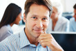 Smart young businesssman taking break from discussion