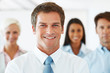 Cheerful businessman leading his successful team