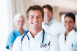 Young doctor standing in frount of his team Young doctor standing in frount of his team