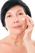Charming lady with cream on her face