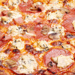 Photo: Pizza with cheese, salami and mushrooms Pizza with cheese, salami and mushrooms