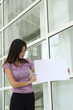 asian girl holding blank cardboard