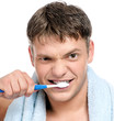 Foto: Young man brushing teeth Young man brushing teeth