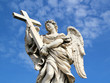 Statue of Angel holding cross.