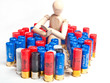 Foto: Man figure on top of fire cartridge pile Man figure on top of fire cartridge pile