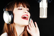 expressive woman singing to the microphone expressive woman singing to the microphone