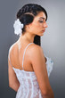serene young bride wearing wedding outfit