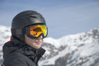 The man in the mountain-skiing form against mountains