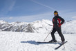 The man in the mountain-skiing form against mountains