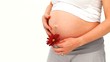 Video: Pregnant woman holding a red flower Pregnant woman holding a red flower