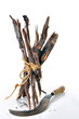 Firewood bundle with sickle on white background