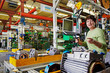 female skilled industrial worker, final assembly of electric mot