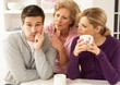 Photo: Senior Mother Interferring With Couple Having Argument At Home Senior Mother Interferring With Couple Having Argument At Home