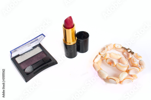 Photo: the scarlet lipstick, eye shadow and coral chaplet the scarlet lipstick, eye shadow and coral chaplet