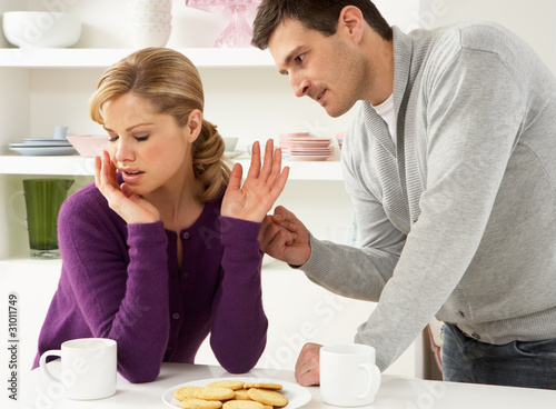 Photo: Couple Having Argument At Home Couple Having Argument At Home
