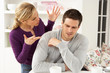 Photo: Couple Having Argument At Home Couple Having Argument At Home