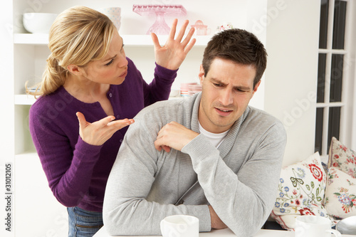 Photo: Couple Having Argument At Home Couple Having Argument At Home