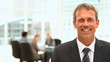 Middle aged businessman looking at the camera