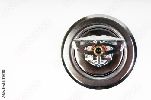 Photo: Close up image of fire sprinkler on white Close up image of fire sprinkler on white