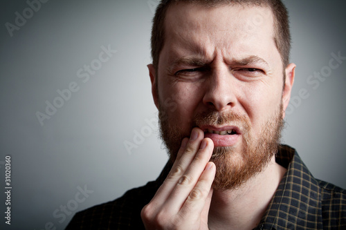 Photo: Toothache - man with teeth problems Toothache - man with teeth problems