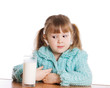 The little girl with a milk glass