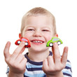 Lachendes Kind mit Spielzeugautos Lachendes Kind mit Spielzeugautos