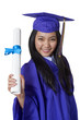 Photo: Asian student holding graduation degree Asian student holding graduation degree