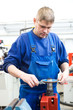 worker checking cutting tool