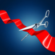 Cutting the ribbon with a blue background