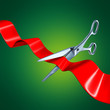 Cutting the ribbon with a green background