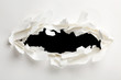 Torn hole through paper