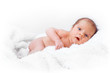 Newborn baby on the white blanket