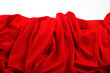 Red satin fabric against white background Red satin fabric against white background
