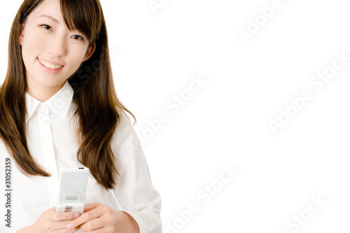 Photo: 携帯電話と女性社員 携帯電話と女性社員