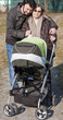 Happy Family Walking with Stroller