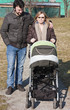 Happy Family Walking with Stroller