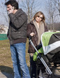 Happy Family Walking with Stroller