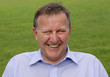 Man laughing and looking at camera