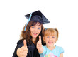 Young mother is graduating with a child Young mother is graduating with a child